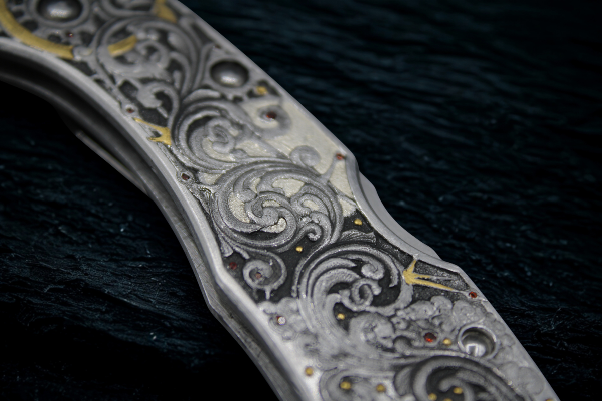 Close-up of a Damascus steel knife blade with intricate patterns on a dark background
