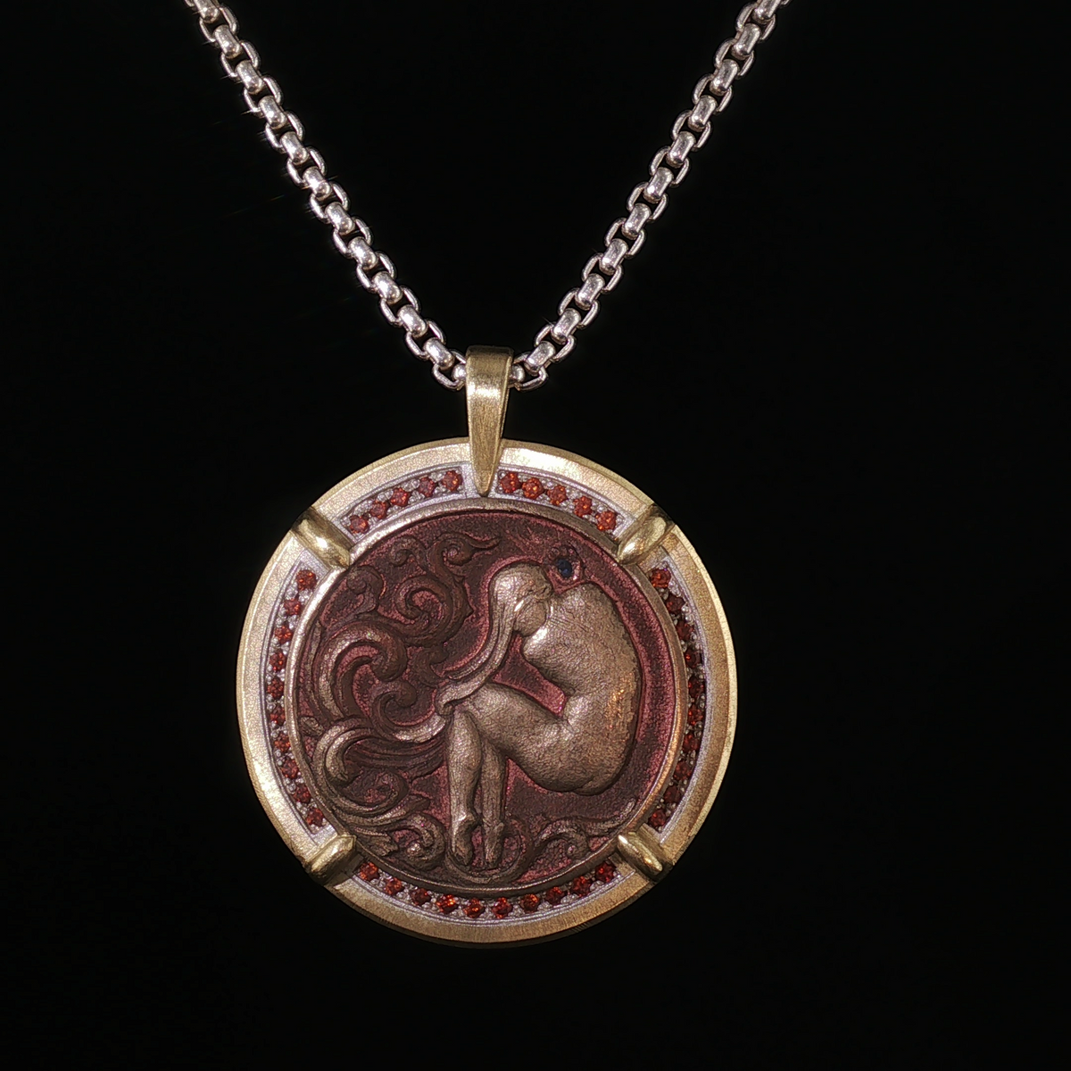 Carved Sacagawea dollar coin pendant set in silver and gold with orange diamonds